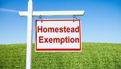 house and homestead exemption sign